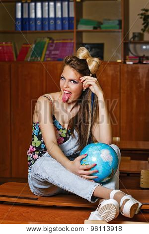 Wild Child In Geography Class With Globe.