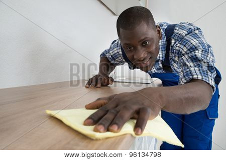 Janitor Cleaning Kitchen Worktop
