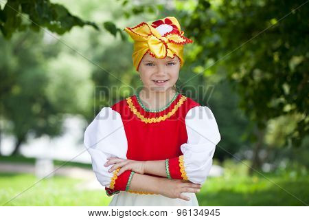 Close up Little girl is dressed in the Russian national dress Ã??Ã?? summer park