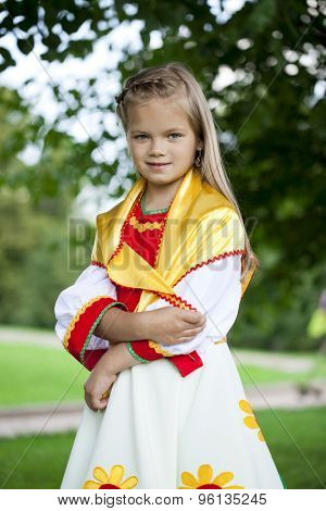 Close up Little girl is dressed in the Russian national dress Ã??Ã?? summer park