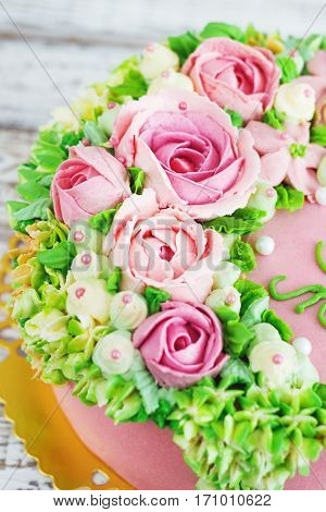 Birthday cake with flowers rose on white background.