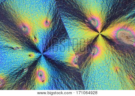 Colorful micro crystals through the microscope in polarized light