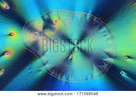 Colorful micro crystals through the microscope in polarized light