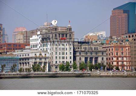SHANGHAI - AUG. 13, 2012: Four historic buildings from left to right are Former Bank of Taiwan, North China Daily News Building, Chartered Bank Building and Former Palace Hotel, in Shanghai, China.