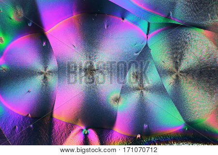 Colorful micro crystals through the microscope in polarized light