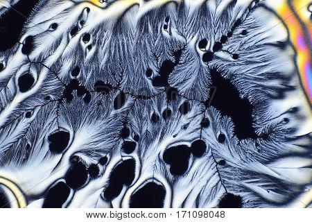 Colorful micro crystals through the microscope in polarized Light
