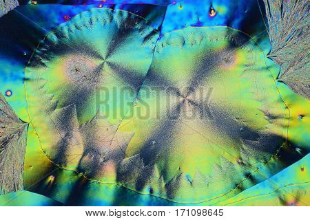 Colorful micro crystals through the microscope in polarized Light