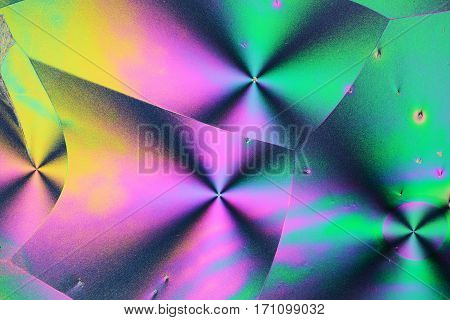 Colorful micro crystals through the microscope in polarized Light
