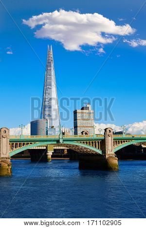 London Southwark bridge and the Shard on Thames river in UK