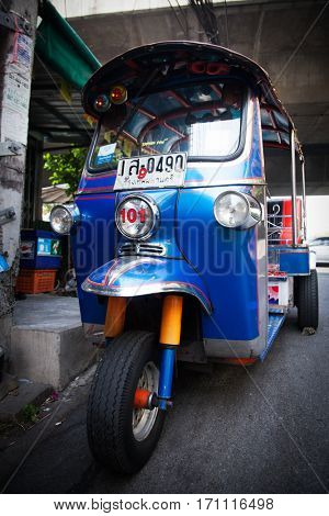 BANGKOK - JAN 24: Street with cars, motorcyclists and tuk tuks Jan 24, 2014 in Bangkok, Thailand. 