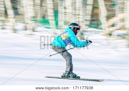 Irkutsk, Russia - February 12, 2017: Slalom competition snowboarding and skiing for adults and children in Irkutsk on the ski base in Akademgorodok Academy Cup in 2017
