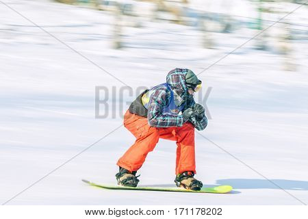 Irkutsk, Russia - February 12, 2017: Slalom competition snowboarding and skiing for adults and children in Irkutsk on the ski base in Akademgorodok Academy Cup in 2017