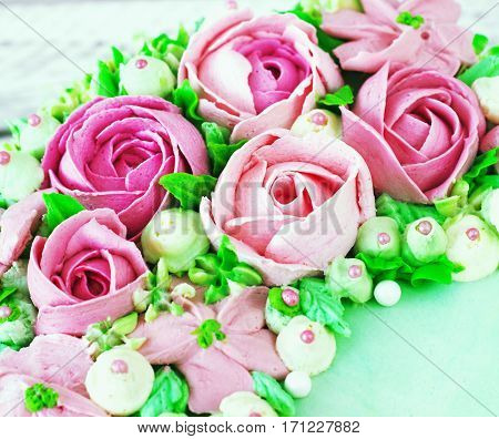 Birthday cake with flowers rose on white background toning
