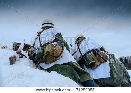 Wehrmacht machine-gun crew. Reconstruction of the winter defensive battles of the Red Army in WWII (1944 year).