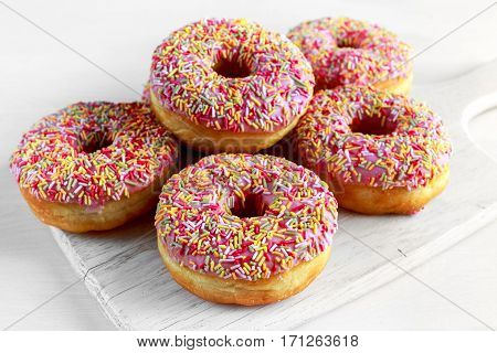 Iced doughnut rings with rainbow sparkl strands