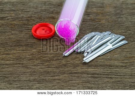 Close up capillary tube with blood lancet Medical equipment on wooden backgroundselective focus.