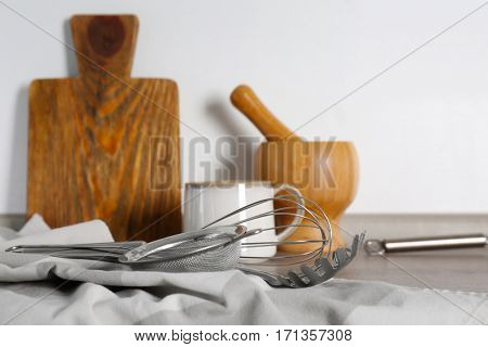 Different cooking utensils on kitchen table