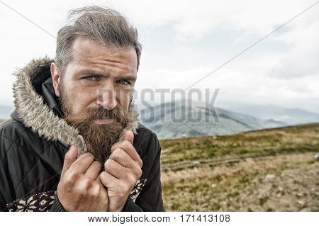 Bearded Man, Brutal Caucasian Hipster With Moustache Cold On Mountain