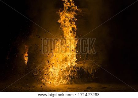 Burning car on the road in the night