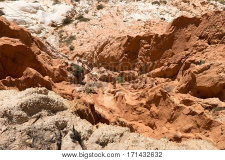 Closeup red cliffs at Praia da Falesia, Algarve, Portugal