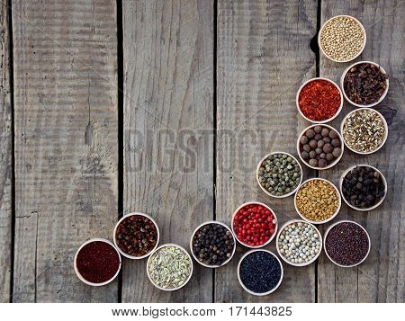 Spices On A Wooden Background. Coriander, Black Pepper, Paprika, Mustard, Turmeric, Cumin, Sumac, Fe