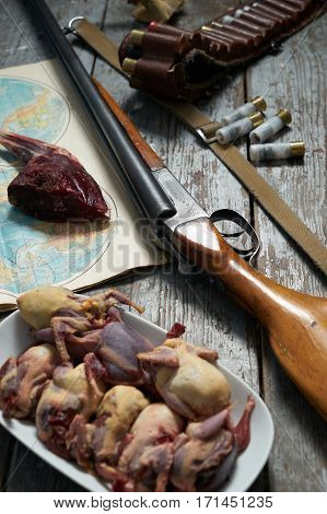 Hunting equipment on old wooden background. contept