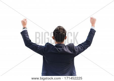 Celebrating success. Back view of excited young Asian businessman arms up while standing isolated on white background with clipping path.