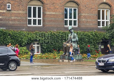 COPENHAGEN, DENMARK - JUNE 29, 2016: This is a monument to Hans Christian Andersen who enjoys the special attention of tourists.