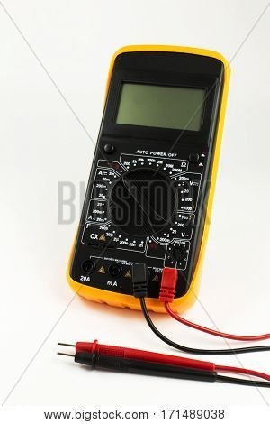 Digital multimeter with probes on the white background