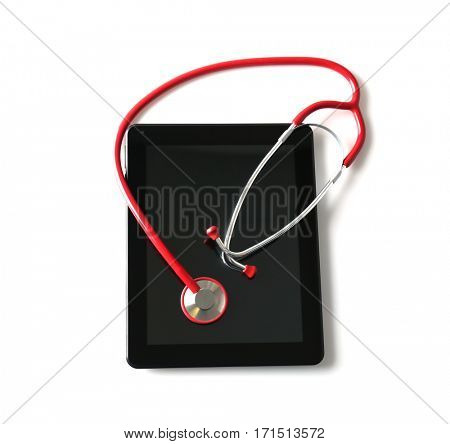 Stethoscope and tablet pc on white background