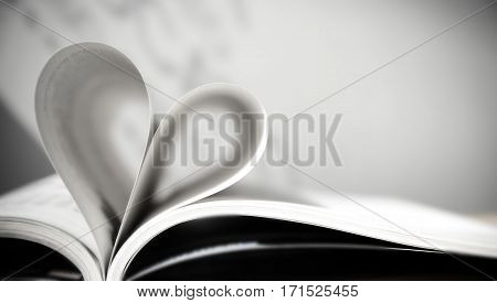 Pages of a book forming the shape of the heart. (love) velantine