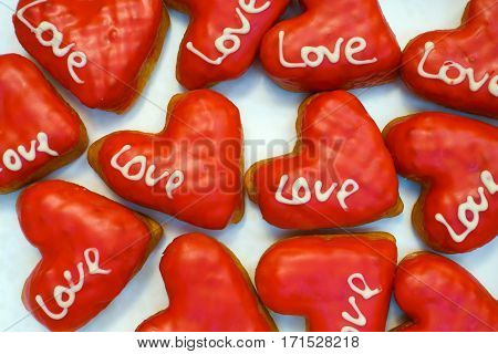 Sweet colorful donuts on Valentine's day, top view