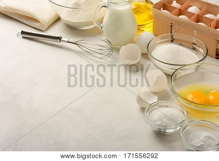 Ingredients for making pancakes on a white background. Copy space.