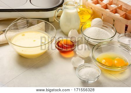 Ingredients for making pancakes on a white background. Copy space.