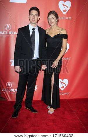 LOS ANGELES - FEB 10:  Christian Riley, Emily Iskra at the Musicares Person of the Year honoring Tom Petty at Los Angeles Convention Center on February 10, 2017 in Los Angeles, CA