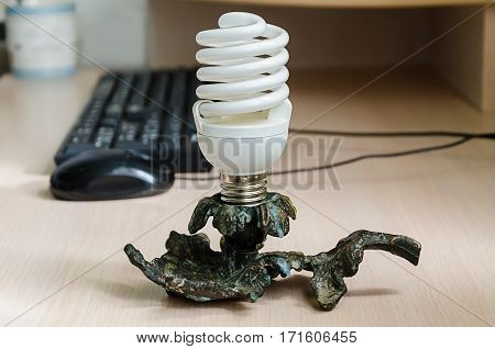 computer desk with a keyboard and mouse and lamp