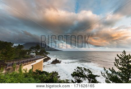 Coastline Road With Mt. Kaimon Volcano In Beautiful Sunset, Kagoshima, Kyushu, Japan.