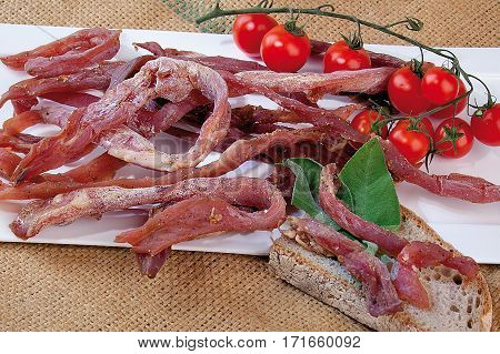 Italian Dried Ham Isolated And Tuscan Bread