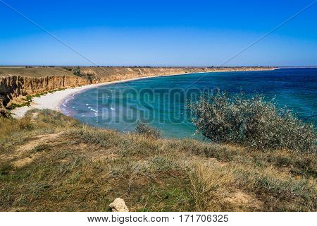 Beautiful sandy beach. Clear blue sea yellow sand and clear sky.