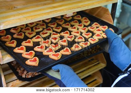 Pastry Filled with Jam on form of hearts on Baking Tray.