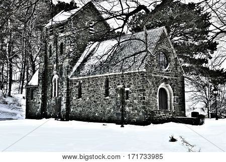The Ellingwood Chapel in Nahant Massachusetts, a Gothic Revival structure built in 1920.The cemetery was established in 1856 shown here snow covered