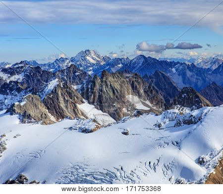 Wintertime view from Mt. Titlis in Switzerland. Mount Titlis is a mountain, located on the border between the Swiss cantons of Obwalden and Bern.