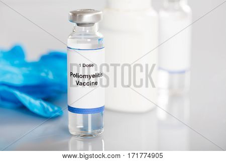 Close-up Of Poliomyelitis Vaccine In Vial Bottle
