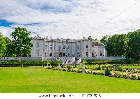 PALANGA LITHUANIA - JULY 12 2015: Unidentified tourists walk near Museum of Amber in Botanical Park Palanga Lithuania