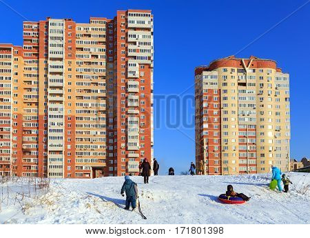 BALASHIKHA/ RUSSIA - JANUARY 21. Winter activities of residents of new buildings built on the banks of the Pekhorka river on January 21, 2016. Balashikha, Moscow region, Russia.