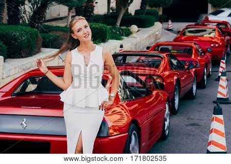Ferrari show 8 october 2016 in Valletta Malta near Grand Hotel Excelsior. Beautiful young girl near the red Ferrari 348 TS
