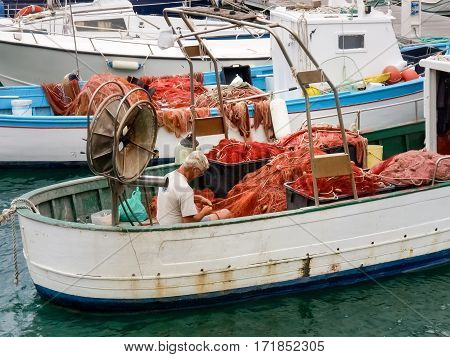 Fisherman System Networks On The Small Boat Moored In The Harbor