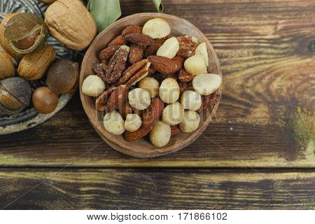Roasted salted nuts mix snack from macadamia walnotes and almonds and unshelled nuts