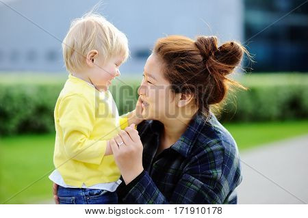 Young Asian Women With Cute Caucasian Toddler Boy