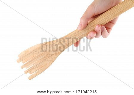 hand holding wooden kitchen tongs isolated on a white background